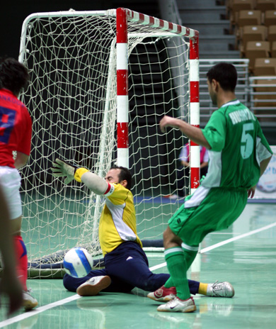 An attempt by Han Kook Shin saved by Iraqi defender Hussein Ali and goalie Abdul Kadir (Photo courtesy: Leadtek Sports)