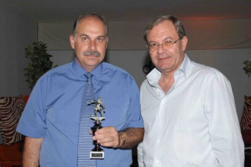 Mr Demetris Solomonides president of Futsal Committee of CFA (right) and ASTERAS Futsal Club president with his fair play award (Photo Cyprus Futsal)