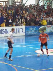 Jay Corran (white shirt) in action in the Romanian league (Photo courtesy: Futsal England)