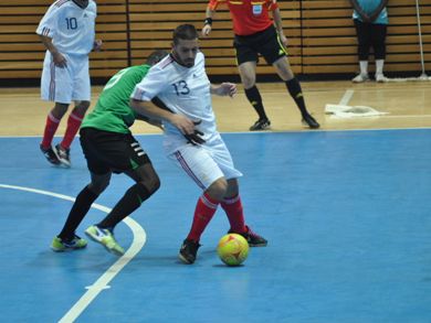 How to stop the eleven goals man Alexandre Teixeira? Bader Hasan Basher has chosen his own way... (Photo courtesy: Mohammed Zayed)