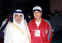 Hassan Rhouila with the Arab Federation president (Photo courtesy: Moroccan FA)