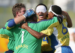 Damiao Ramos congratulated after scoring the winning penalty for Brazil (Photo courtesy: www.athens2004.com)