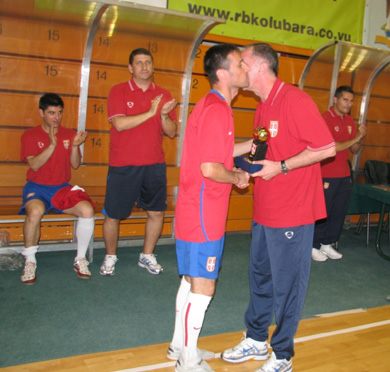 Serbian coach Aca Kovacevic paying tribute to Predrag Rajic. A hug between two legends of futsal. Cvetanovic, Knezevic and Gacic join the moment as well (Photo courtesy: Predrag Bajic)