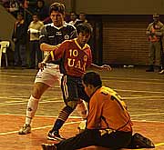 Cristian Acu�a, UAA goalkeeper,  save a ball while his team mate Andr�s Le�n and Ismael Br�tez (Olimpia) are looking at him (Photo courtesy: Diario ABC Color)